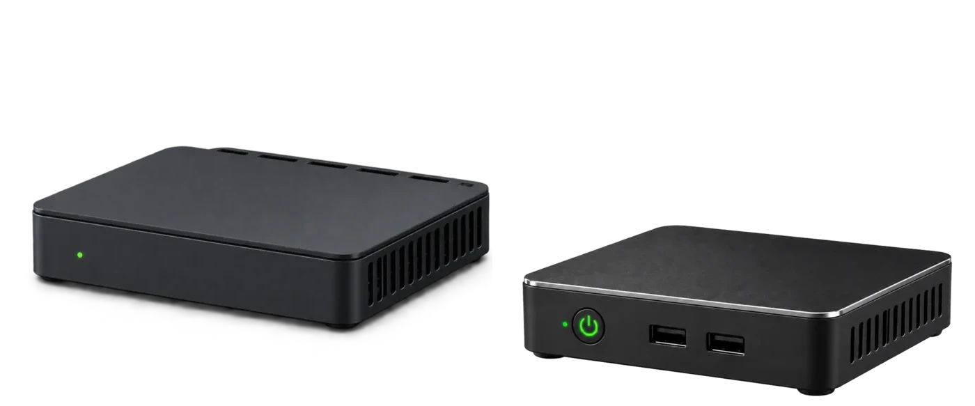The two appliances side by side in three-quarter view. The Guardian router is a wide, flat charcoal box with a small green status light; the Home Cloud server is a low, square slab with an illuminated green power button and two USB ports on the front.